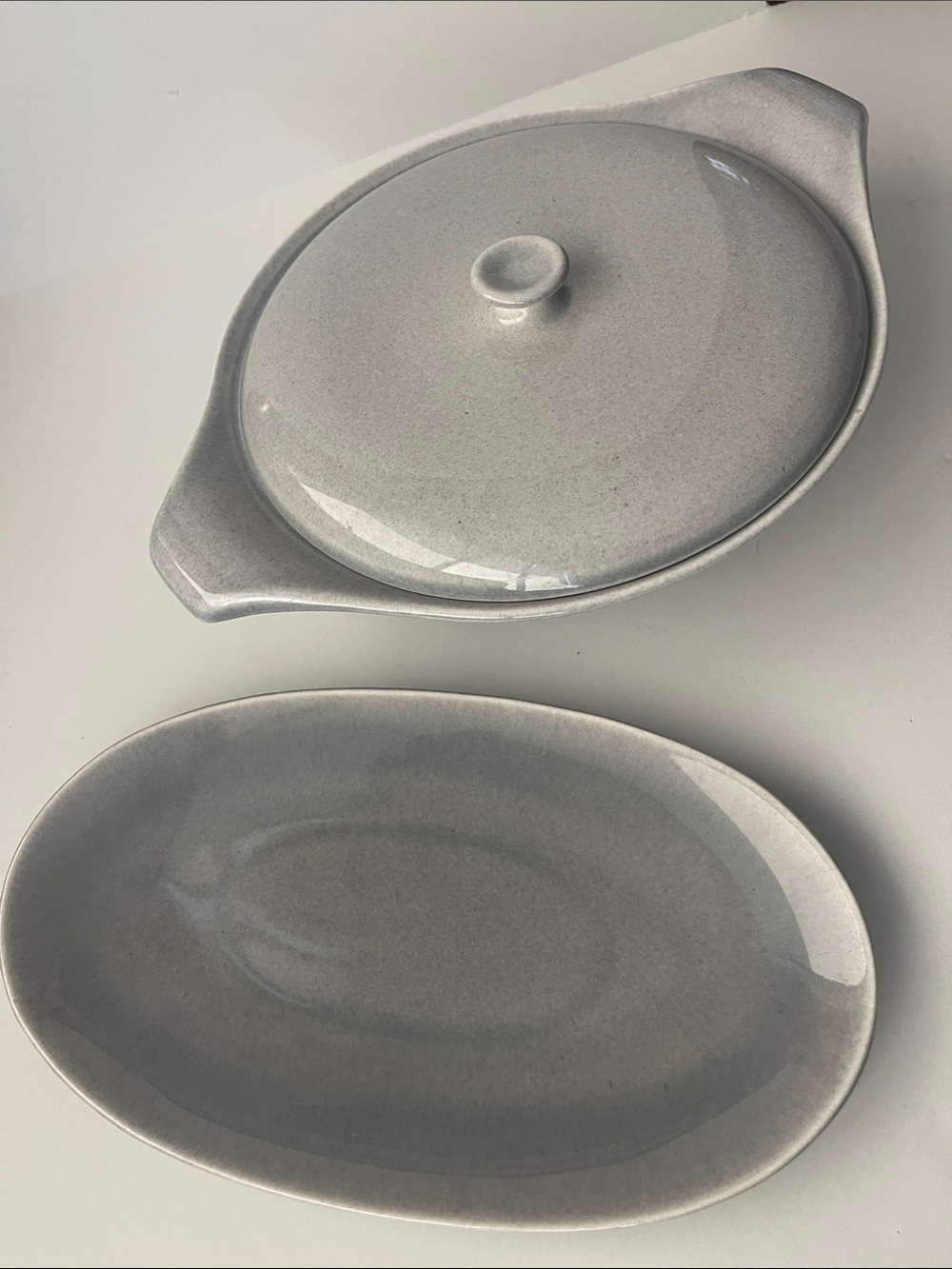 Russel Wright gray 11” dish and 8” casserole with lid.